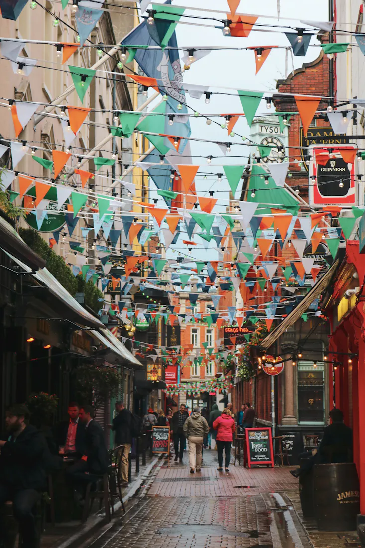 Colourful houses below a cathedral in Cobh, Ireland